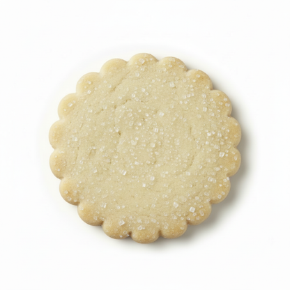 Large pale white scalloped shortbread cookie with sugar